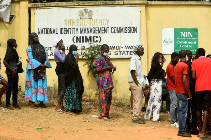 Nigerians queue to obtain the precious National Identity Number -- without it, their mobile phone may be cut off