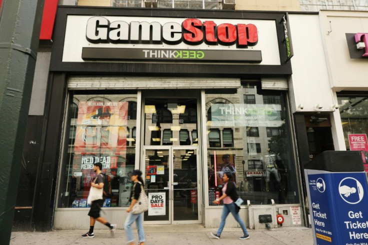 People pass a GameStop store in lower Manhattan on September 16, 2019 in New York City