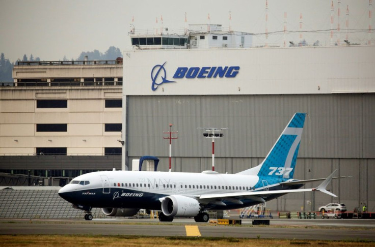 In this file photo taken on September 30, 2020 a Boeing 737 MAX airliner piloted by Federal Aviation Administration (FAA) Administrator Steve Dickson taxis for a two-hour evaluation flight at Boeing Field in Seattle, Washington