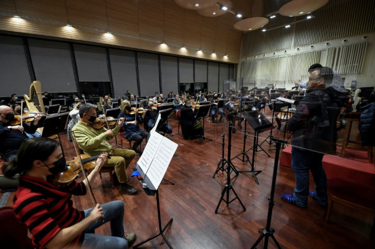 Musicians of the Teatro Real's main orchestra rehearse at the Teatro Real in Madrid on January 14.