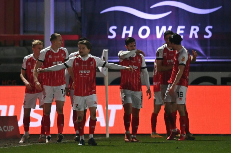 Cheltenham players celebrate Alfie May's goal in the FA Cup fourth round against Manchester City