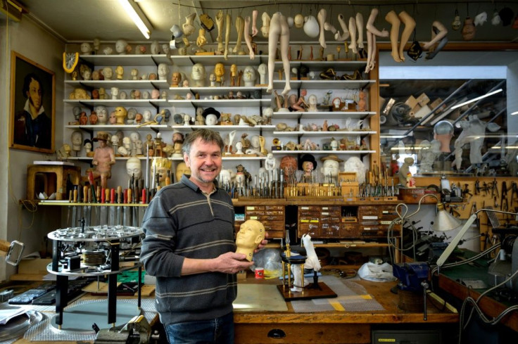 Swiss master Francois Junod, in his workshop of moving mechanical artworks, says the craft requires patience -- an automaton of Russian writer Alexander Pushkin took five years to complete