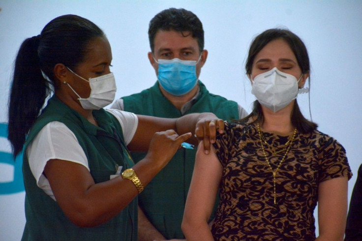 A healthcare worker receives an injection of the CoronaVac vaccine on January 19, 2021 in Manaus, Brazil