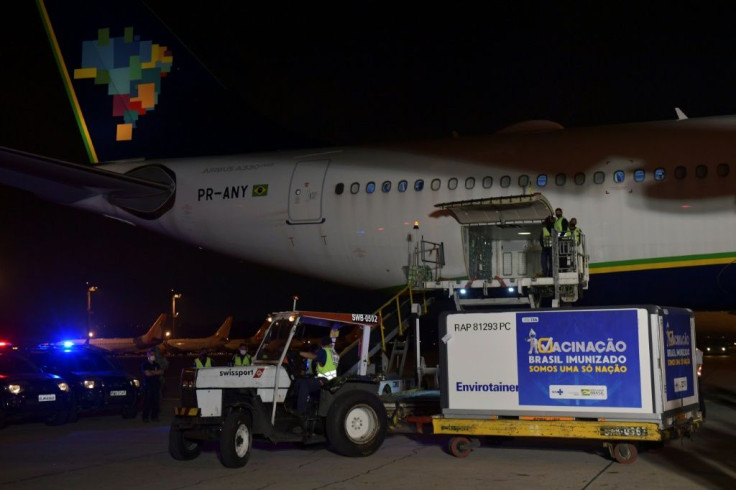 A shipment of the AstraZeneca/Oxford vaccine is unloaded from a cargo plane arriving from India on January 22, 2021 at Guarulhos airport near Sao Paulo, Brazil