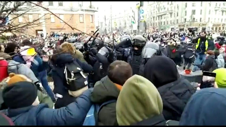 Officers detain protesters at a demonstration in Moscow in support of prominent Kremlin critic Alexei Navalny. He called the demonstrations after he was detained returning to Russia from Germany where he had been recovering from being poisoned with a Sovi