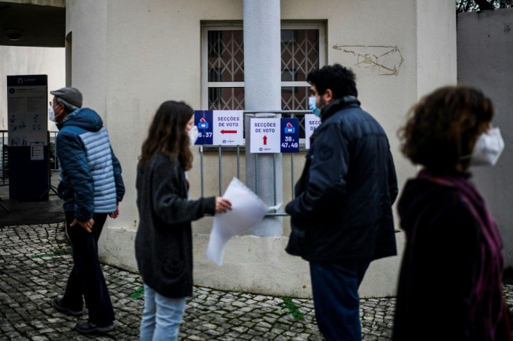 Voters queued outside polling stations in the capital Lisbon, being let in one by one under social distancing rules