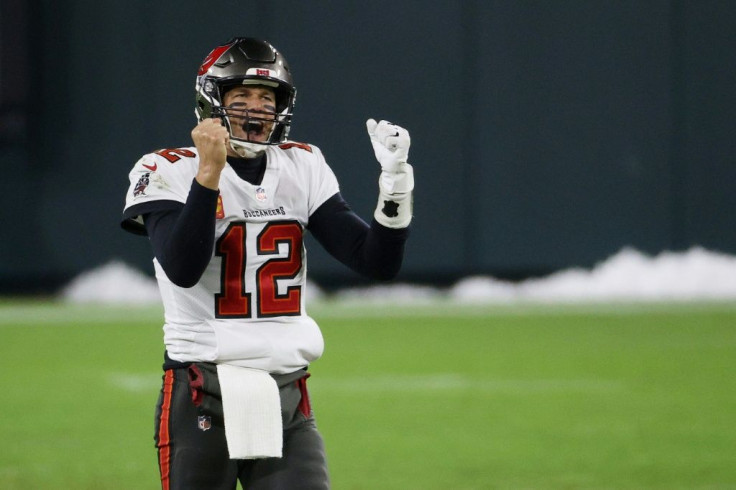 Tom Brady celebrates as the Tampa Bay Buccaneers complete a 31-26 victory over the Green Bay Packers at Lambeau Field on Sunday