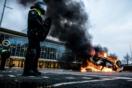 Police fired tear gas in the southern city of Eindhoven, where looting was reported