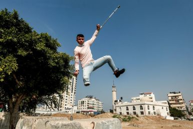 Mohamed Aliwa, a Palestinian youth whose leg was amputated near the knee in 2018 after he was hit by Israeli army fire, shows off his parkour skills