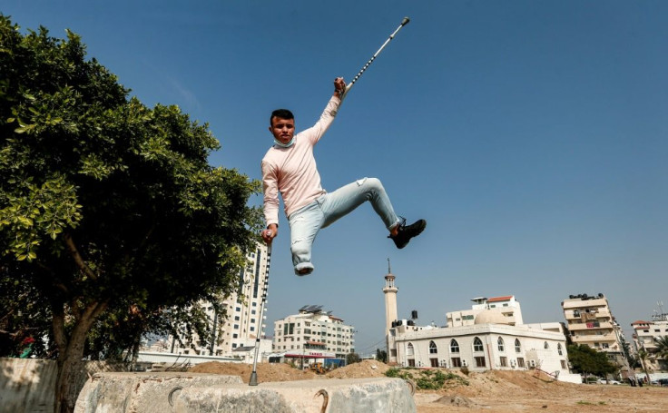 Mohamed Aliwa, a Palestinian youth whose leg was amputated near the knee in 2018 after he was hit by Israeli army fire, shows off his parkour skills