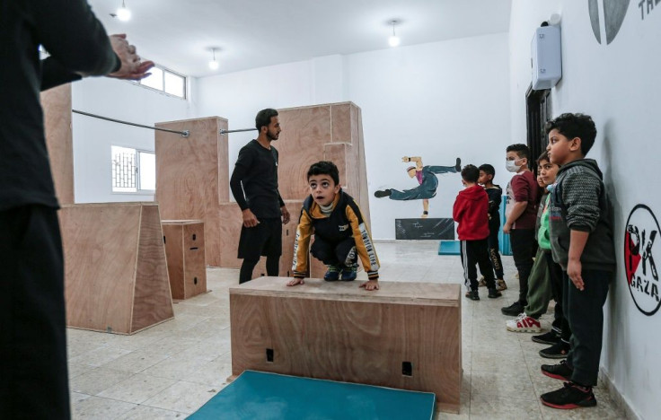 A coach trains Palestinian children at the Wallrunners Parkour Academy in Gaza; parkour is an extreme sport also known as free-running that originated in France in the 1990s