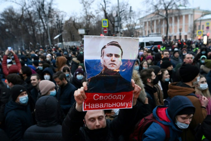 Protesters march in support of jailed opposition leader Alexei Navalny, who was jailed upon returning to Russia after five months in Germany recovering from a near-fatal poisoning, in downtown Moscow on January 23, 2021