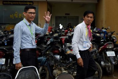 Former Radio Free Asia journalists Oun Chhin (right) and Yeang Sothearin arrive at a court in Phnom Penh in August 2019, one of a number of cases of governments acting against the US-based broadcaster
