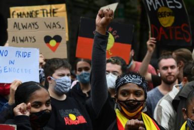 Thousands defied coronavirus rules to rally in cities across Australia on Tuesday to protest the country's national day