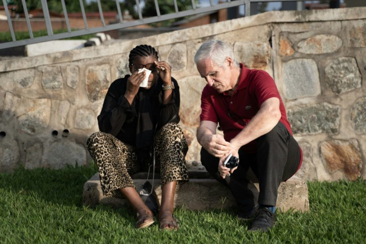 Mukakamanzi has for years been helping Alain Gauthier (R), who, with his wife, tracks down genocide suspects sheltering in France