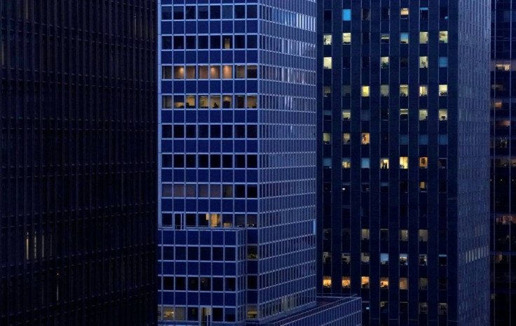 Office buildings in midtown Manhattan that used to be fully lit at sundown now show few signs of occupancy