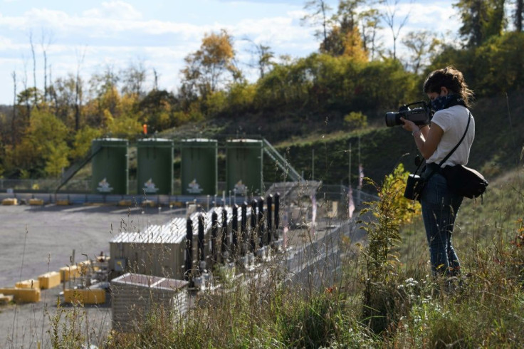 Environmental activist Leann Leiter uses an infrared camera to look for invisible emissions from the Mad Dog 2020 fracking site in Pennsylvania