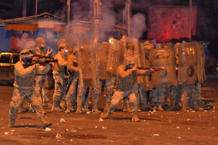 Lebanese soldiers fire rubber bullets and tear gas during clashes with protesters in Tripoli that the Red Cross says injured at least 45 people