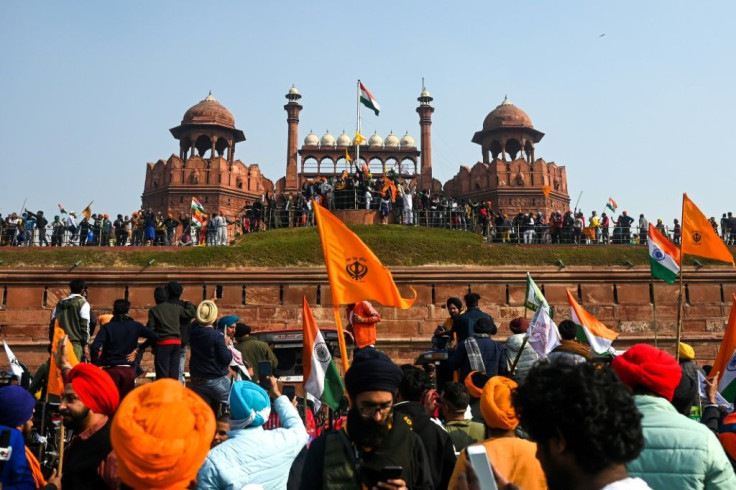 At the historic Red Fort landmark farmers broke through police lines and put up their own emblem on the flagpole