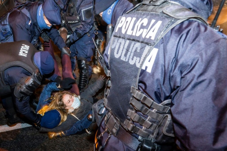 Police removes demonstrators while they block the traffic during a pro-choice protest in the center of Warsaw, on November 28, 2020, as part of a nationwide wave of protests since October 22, 2020 against Poland's near-total ban on abortion