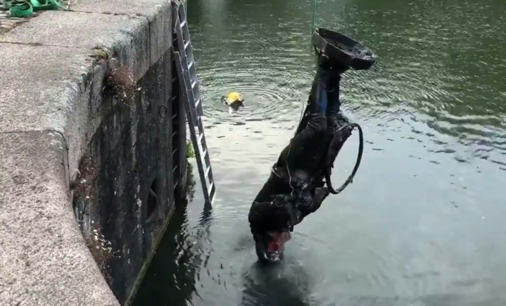 The statue of 17th century slave trader Edward Colston in the harbour in Bristol, southwest England last June after beng toppled by anti-racism protesters