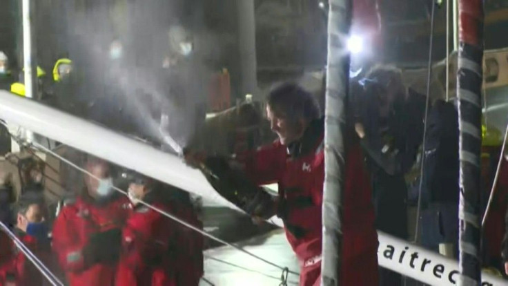 France's Yannick Bestaven sprays champagne after  winning the Vendee Globe round-the-world solo yacht race