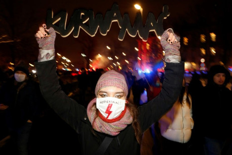 A demonstrator in Warsaw  on Thursday