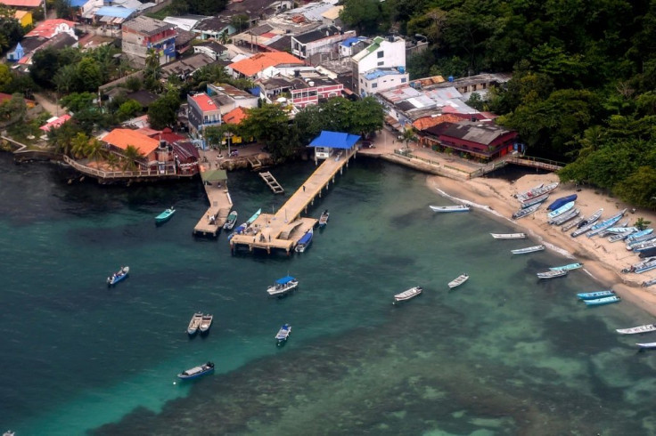 File image of the town of Capurgana, near Necocli, and the Gulf of Uraba during a  Colombian Air Force helicopter flight in Choco department, Colombia, near the border with Panama, on October 14, 2020