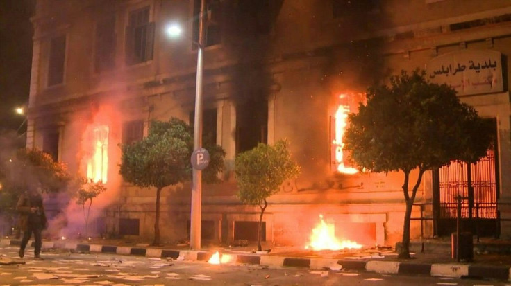 IMAGESFlames billow from the windows of the town hall on the fourth night of angry protests over the government's handling of the coronavirus pandemic in Lebanon's impoverished northern city of Tripoli.