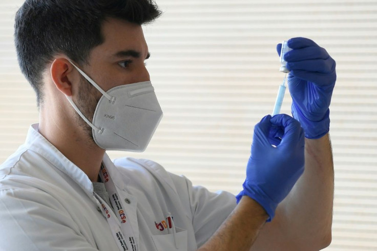 A medical worker prepares a Moderna Covid-19 vaccine at the Hospital Sant Joan de Deu in Barcelona on January 16, 2021