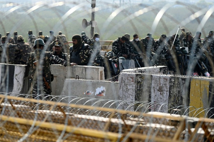 Indian police have blocked roads, cut off internet and tightened security around camps full of farmers protesting rural reform