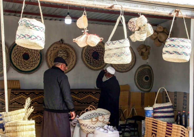 Customers inspect palm wicker products