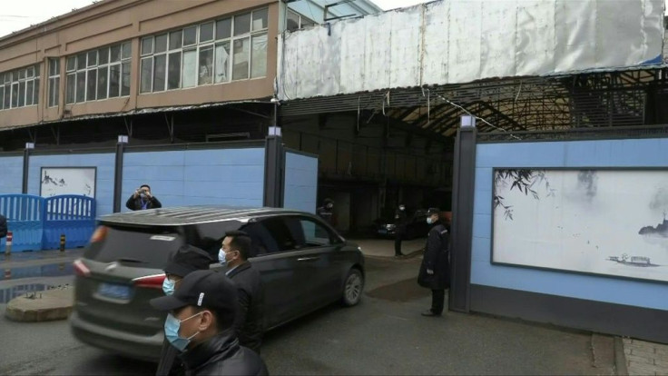 IMAGESA team of WHO experts investigating the origins of Covid-19 arrives at a market in Wuhan where one of the first reported clusters of infections emerged over a year ago.