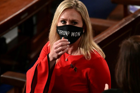 Marjorie Taylor Greene wears a "Trump Won" face mask as she arrives to take her oath of office as a newly elected member of the House of Representatives