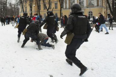 Russian police clash with protesters during a rally in support of jailed opposition leader Alexei Navalny in Saint Petersburg on January 31, 2021