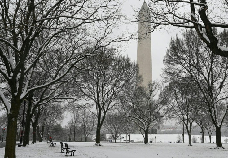 The Washington Monument is seen from the snow-covered National Mall in Washington, DC on January 31, 2021 as the capital region is under a winter storm warning for an expected five or more inches (12.7 centimeters) of snow
