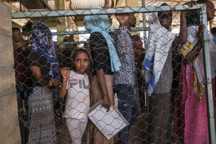 Queueing for aid: For some, life in the camp is all they have known