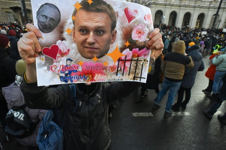 Russians rally for the release of jailed opposition leader Alexei Navalny who was arrested last month after returning to Russia from Germany where doctors treated him for poisoning by the Soviet-era nerve agent Novichok