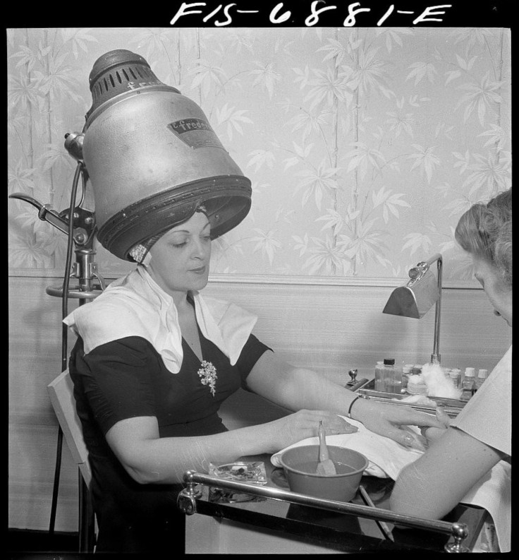 A woman having her nails and hair done