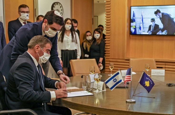Israeli Foreign Minister Gabi Ashkenazi (L) signed a joint declaration establishing diplomatic ties with Kosovo during a ceremony held over Zoom with his counterpart from Kosovo, Meliza Haradinaj-Stublla, at Israel's foreign ministry in Jerusalem