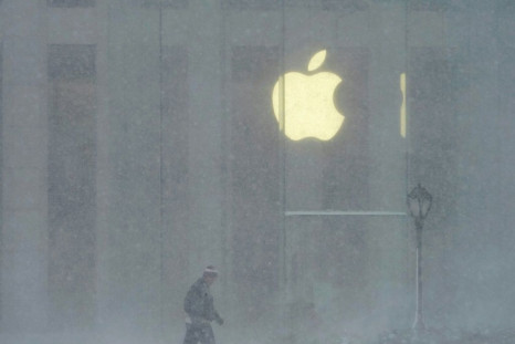A person walks past the Apple Store on 5th Avenue during a winter storm on February 1, 2021 in New York City