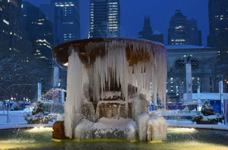 The Josephine Shaw Lowell Memorial Fountain is seen covered in ice during a winter storm on February 1, 2021 in New York City