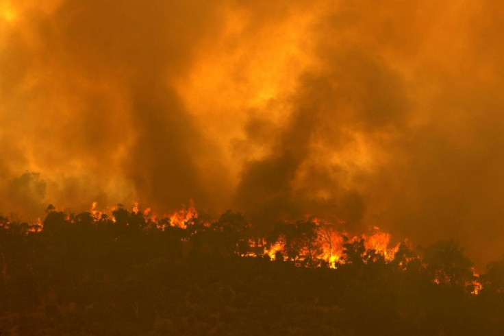 Firefighters are battling the out-of-control bushfire on the city's eastern fringes, where several properties are ablaze