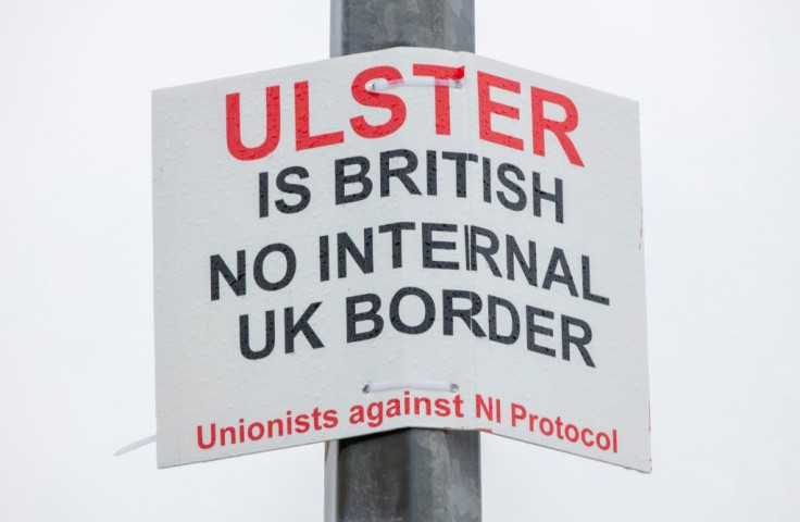 Hardcore unionists have been blamed for graffiti criticising the Northern Ireland Protocol and describing port staff as "targets"