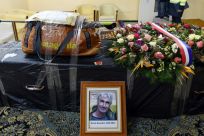 The backpack and walking stick of French mountaineer Herve Gourdel, who was kidnapped and beheaded by jihadists in Algeria in 2014, sits on his coffin before it was flown to Paris, in this picture taken on January 26, 2015