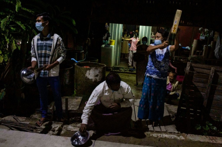 The clatter of pots and pans -- and the honking of car horns -- rang out across Yangon on Tuesday evening after calls for protest went out on social media