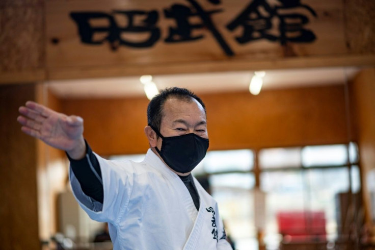 Karate teacher Kazuo Okano is hoping to take part in the rescheduled torch relay