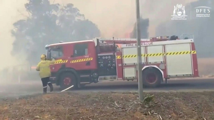 Firefighters battle a blaze that has destroyed at least 71 homes near Australia's fourth-biggest city of Perth, as authorities told residents to ignore a virus lockdown and evacuate threatened areas.