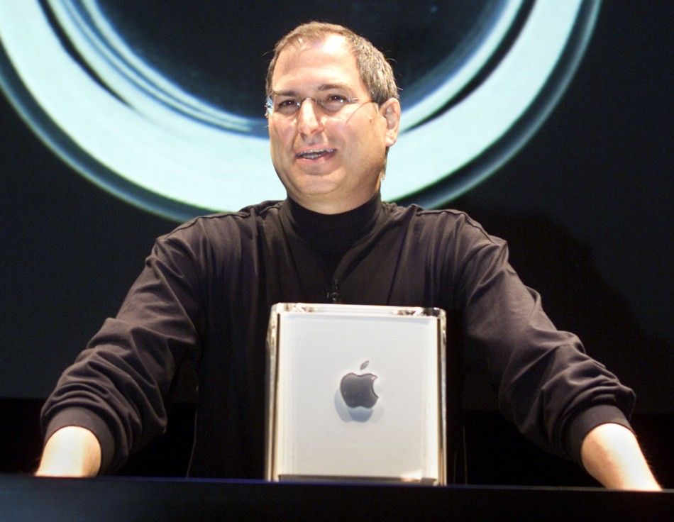 Apple Computer Inc. founder Steve Jobs poses with the companys new Power Mac G4 Cube in 2000