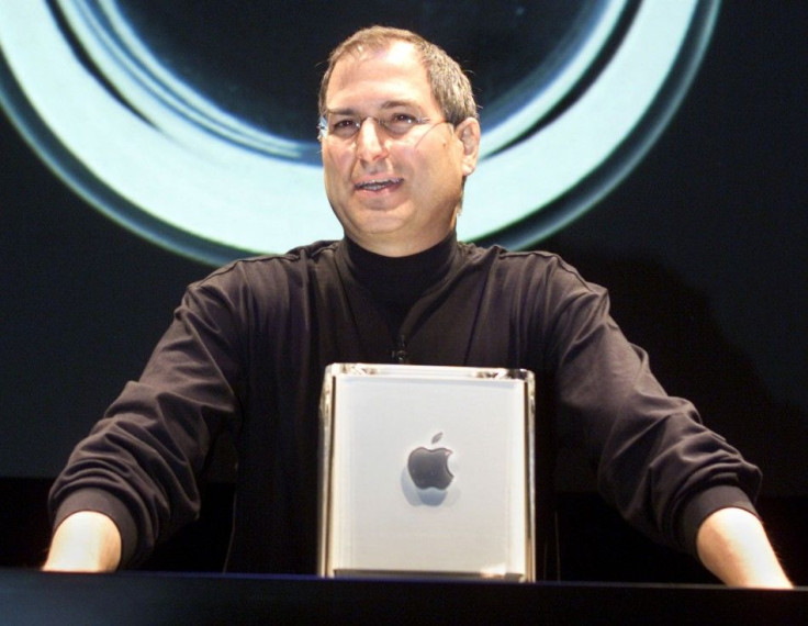 Apple Computer Inc. founder Steve Jobs poses with the company's new Power Mac G4 Cube in 2000